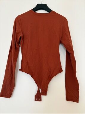 SKIMS Long Sleeve Bodysuit in Rust